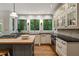 Kitchen with custom cabinets, hardwood flooring, an island, and stainless steel appliances at 4442 Freeman Rd, Marietta, GA 30062