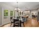 Spacious open kitchen and breakfast area with island, stainless appliances and hardwood flooring at 4442 Freeman Rd, Marietta, GA 30062