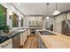 Updated kitchen boasting stainless steel appliances, island, and hardwood flooring at 4442 Freeman Rd, Marietta, GA 30062
