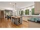 Spacious kitchen with island, hardwood floors, and view to the staircase at 4442 Freeman Rd, Marietta, GA 30062