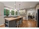 Charming kitchen featuring stainless appliances, custom cabinets, hardwood floors, and a center island at 4442 Freeman Rd, Marietta, GA 30062