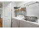 Laundry room features modern washer and dryer with storage shelves at 4442 Freeman Rd, Marietta, GA 30062
