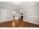 Bright living room boasting hardwood floors, neutral paint, and french doors to nearby rooms at 4442 Freeman Rd, Marietta, GA 30062