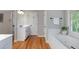 Bright main bathroom boasts a jacuzzi tub, vanity, and separate water closet at 4442 Freeman Rd, Marietta, GA 30062
