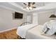 This main bedroom offers hardwood floors, neutral paint, and a tray ceiling at 4442 Freeman Rd, Marietta, GA 30062