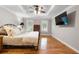 Bright main bedroom offers hardwood floors, neutral paint, and a tray ceiling at 4442 Freeman Rd, Marietta, GA 30062