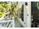 Inviting private balcony with black front door entry, and natural light, providing a tranquil outdoor space at 104 Terrace Ne Dr # 1, Atlanta, GA 30305