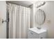 Bathroom with a shower curtain, vanity, and updated lighting fixture at 104 Terrace Ne Dr # 1, Atlanta, GA 30305