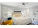 Bedroom with a ceiling fan, plantation shutters, hardwood floors, and a plush bed at 104 Terrace Ne Dr # 1, Atlanta, GA 30305