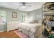 Bedroom with a ceiling fan, hardwood floors, and a comfortable bed with a pink rug at 104 Terrace Ne Dr # 1, Atlanta, GA 30305