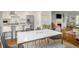 Light-filled dining area with a modern table setup and seamless flow to the open living spaces and kitchen at 104 Terrace Ne Dr # 1, Atlanta, GA 30305