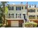 Charming two-story townhome featuring a private balcony, brick facade and garage access in a desirable community at 104 Terrace Ne Dr # 1, Atlanta, GA 30305