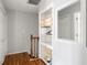 Bright hallway with hardwood floors, a built-in bookshelf, and plenty of natural light at 104 Terrace Ne Dr # 1, Atlanta, GA 30305
