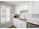 Bright kitchen with white cabinets, granite countertops, stainless steel appliances, and a double sink at 104 Terrace Ne Dr # 1, Atlanta, GA 30305