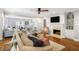 Spacious living room featuring a fireplace, hardwood floor, and an open layout perfect for entertaining at 104 Terrace Ne Dr # 1, Atlanta, GA 30305