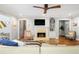 Cozy living room features a fireplace, hardwood floor, and views into adjacent dining and kitchen areas at 104 Terrace Ne Dr # 1, Atlanta, GA 30305