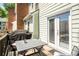 Patio with a grill, table, and chairs, perfect for outdoor dining at 104 Terrace Ne Dr # 1, Atlanta, GA 30305