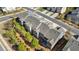 Aerial shot of townhomes surrounded by lush landscaping and well-maintained roadways at 120 Maple Creek Way, Woodstock, GA 30188