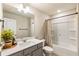 The full bathroom features a single vanity, neutral paint, updated lighting, and a shower-tub combo at 120 Maple Creek Way, Woodstock, GA 30188