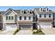 Charming townhomes with brick and siding exteriors, garages, and well-maintained lawns at 120 Maple Creek Way, Woodstock, GA 30188