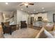 Open concept living room features wood floors, stairs to second floor, and kitchen with bar stool seating at 120 Maple Creek Way, Woodstock, GA 30188