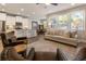 Open concept living room featuring hardwood floors, neutral paint, lots of light and stainless steel kitchen appliances at 120 Maple Creek Way, Woodstock, GA 30188