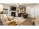 Cozy living room featuring a fireplace, built-in shelving, and hardwood floors at 120 Maple Creek Way, Woodstock, GA 30188