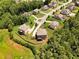 Aerial view of homes in neighborhood and lush greenery that adds to the neighborhood's charm at 279 Sturry Dr, Mcdonough, GA 30252