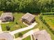 Aerial view showcasing the home's premium lot with mature trees and verdant lawns at 279 Sturry Dr, Mcdonough, GA 30252