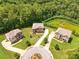 An aerial view of the neighborhood showing lush landscaping and well-manicured lawns at 279 Sturry Dr, Mcdonough, GA 30252