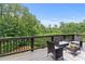 Inviting back deck featuring comfortable seating and scenic views of lush greenery at 279 Sturry Dr, Mcdonough, GA 30252
