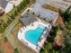 Aerial view of community pool offering ample seating and mature trees for privacy at 279 Sturry Dr, Mcdonough, GA 30252