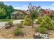 Charming front yard featuring vibrant plants, rock landscaping, and a well-maintained lawn at 279 Sturry Dr, Mcdonough, GA 30252