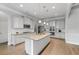 Open kitchen with granite countertops, stainless steel appliances, and white cabinetry at 279 Sturry Dr, Mcdonough, GA 30252