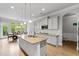 Bright kitchen featuring granite countertops, stainless steel appliances, and an island at 279 Sturry Dr, Mcdonough, GA 30252