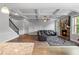 Spacious living room with coffered ceiling, stone fireplace, and an open layout at 279 Sturry Dr, Mcdonough, GA 30252