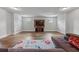Well-lit living room featuring hardwood flooring, neutral walls and a mounted television at 279 Sturry Dr, Mcdonough, GA 30252