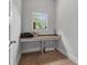Small office nook with a built-in desk, carpet, and a window at 279 Sturry Dr, Mcdonough, GA 30252