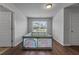 Room with a playpen, wood floors, and natural light at 279 Sturry Dr, Mcdonough, GA 30252