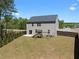 Spacious backyard featuring a playset, patio, and privacy fence perfect for outdoor enjoyment at 435 Noblewood Dr, Mcdonough, GA 30252