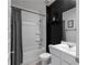 Bathroom featuring a shower-tub, modern toilet, vanity with sink, and minimalist wall decor at 435 Noblewood Dr, Mcdonough, GA 30252