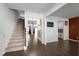Inviting entryway showcases hardwood floors, staircase, and an open floor plan into the living spaces at 435 Noblewood Dr, Mcdonough, GA 30252