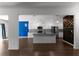 Open concept kitchen featuring white cabinets, a center island, and stainless steel appliances, perfect for entertaining at 435 Noblewood Dr, Mcdonough, GA 30252