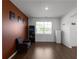 Cozy living room with hardwood floors, a chair, and warm-toned accent wall, creating a relaxing atmosphere at 435 Noblewood Dr, Mcdonough, GA 30252