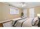 Cozy bedroom with hardwood floors, ceiling fan and a bright window with blinds at 798 Saint Charles Ne Ave # 7, Atlanta, GA 30306