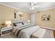 Inviting bedroom featuring hardwood floors, neutral walls, and a cozy bench at the foot of the bed at 798 Saint Charles Ne Ave # 7, Atlanta, GA 30306