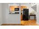 Well-lit kitchen features stylish wooden cabinetry, modern appliances, and a breakfast bar at 798 Saint Charles Ne Ave # 7, Atlanta, GA 30306