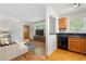 Bright living room with an open layout to the kitchen, complemented by hardwood floors and modern decor at 798 Saint Charles Ne Ave # 7, Atlanta, GA 30306