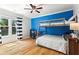 Bedroom with bunkbeds, desk, hardwood floors, a ceiling fan and natural light from the windows at 920 Pebblestone Ct, Alpharetta, GA 30009