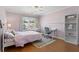 Bedroom with a pink color scheme, desk, shelving, and egg chair for lounging and relaxing at 920 Pebblestone Ct, Alpharetta, GA 30009